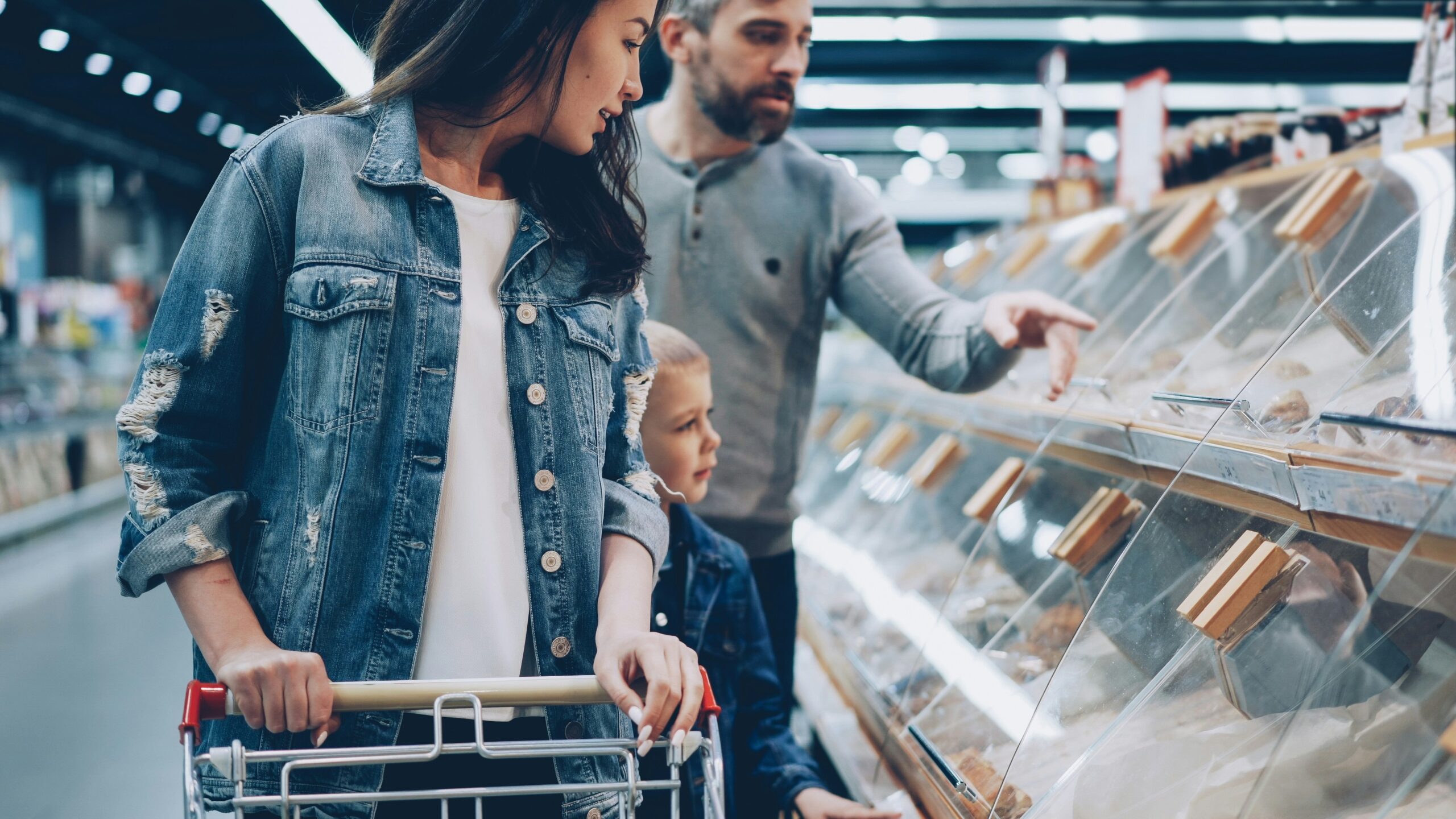A family is shopping in a grocery store.