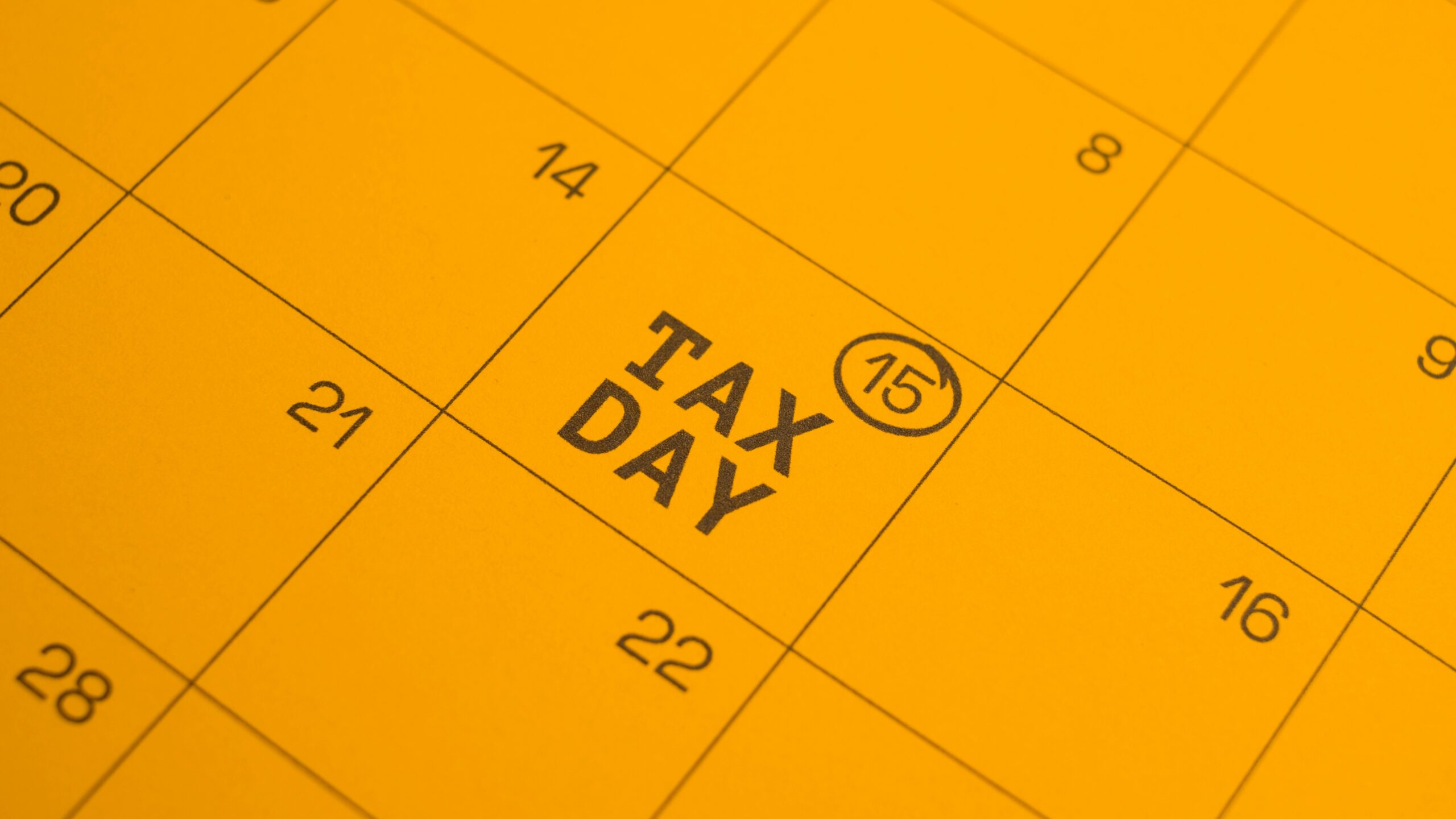 Calendar shows "tax day" circled on the 15th.