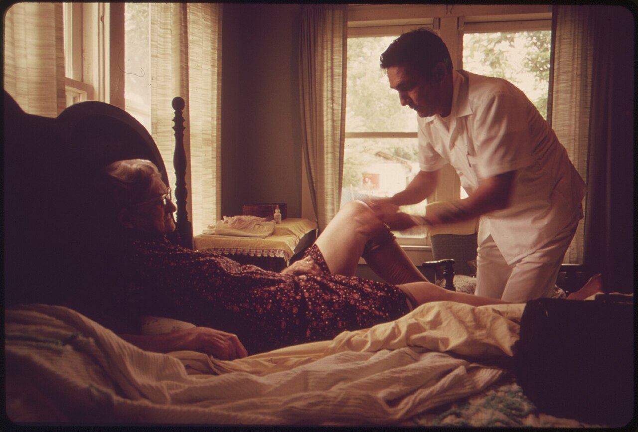 A doctor visiting an elderly patient