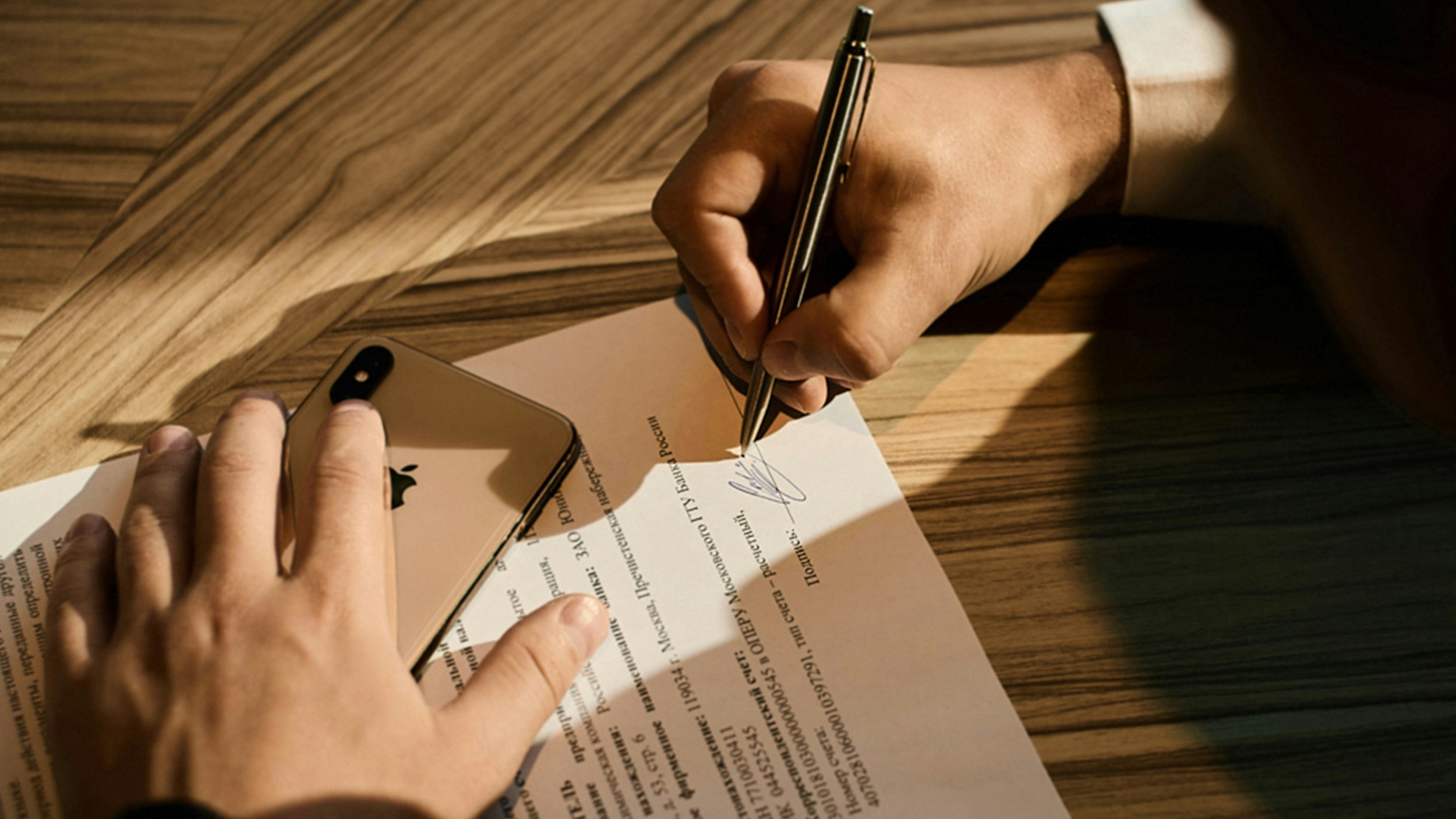 person writing on white paper