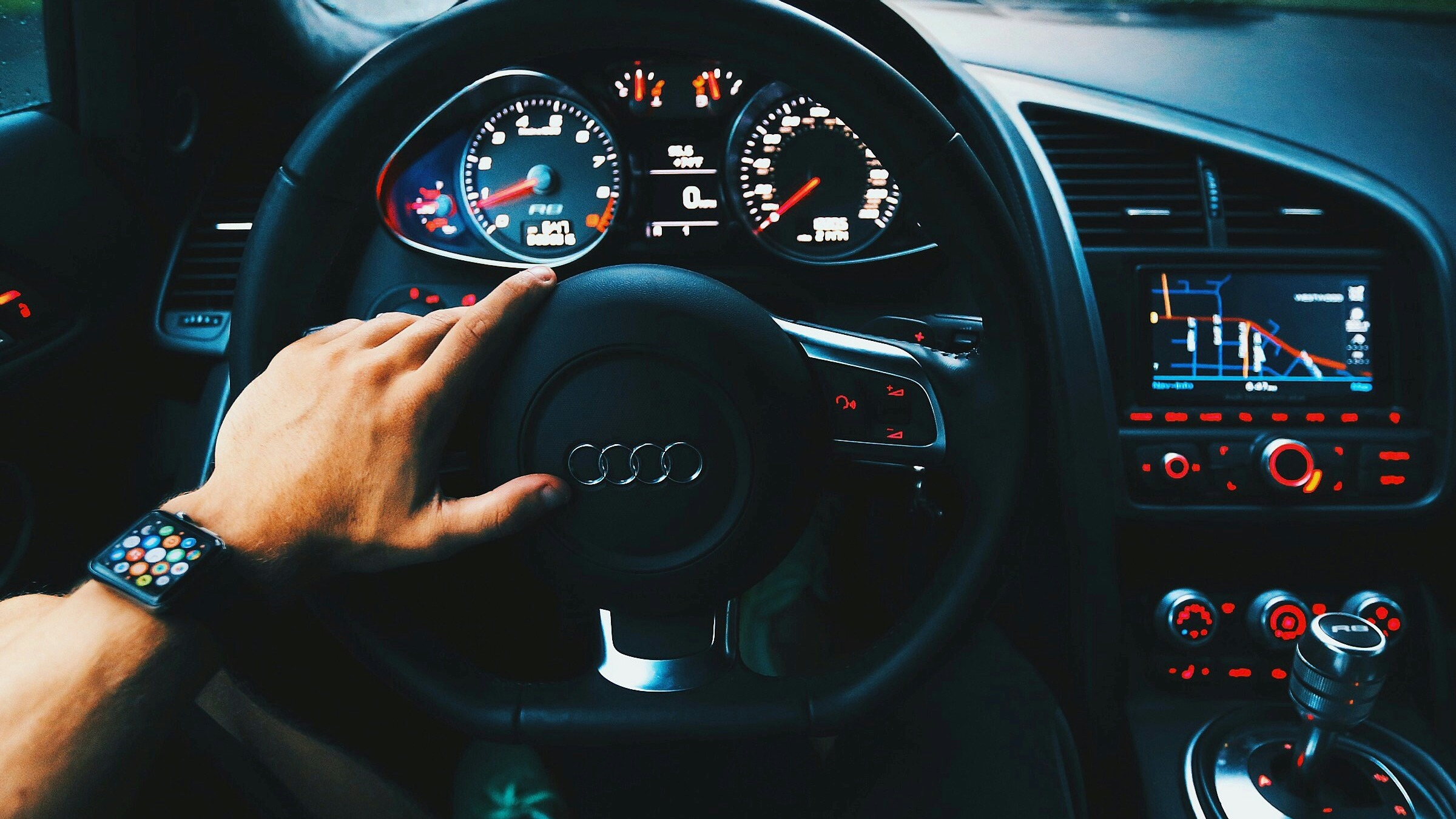 black Audi vehicle steering wheel