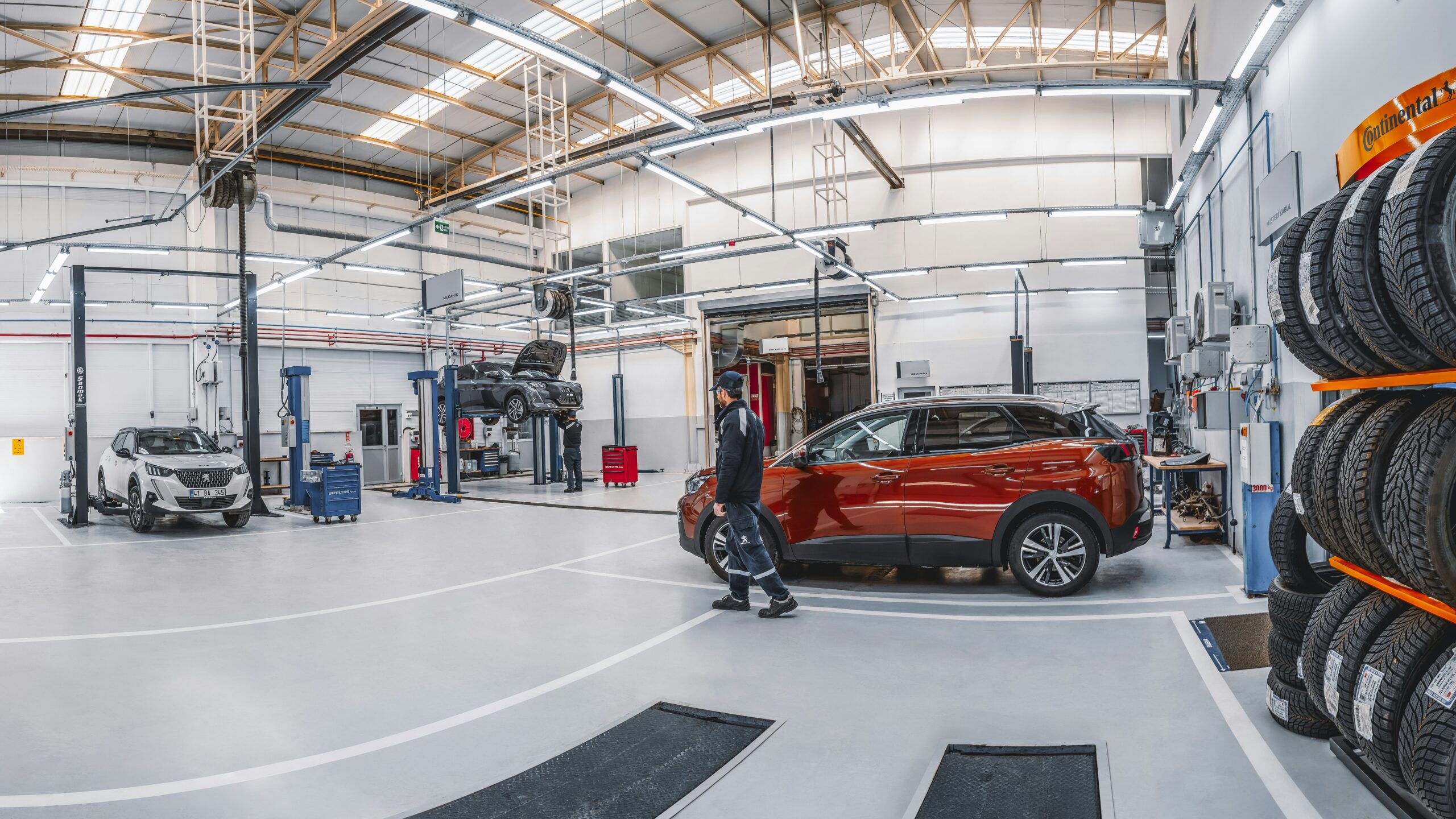 A car is parked inside of a garage