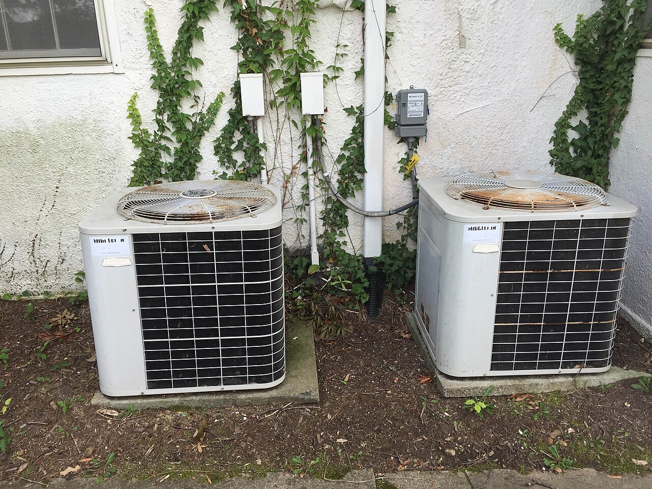 Central air conditioning condenser units outside a building