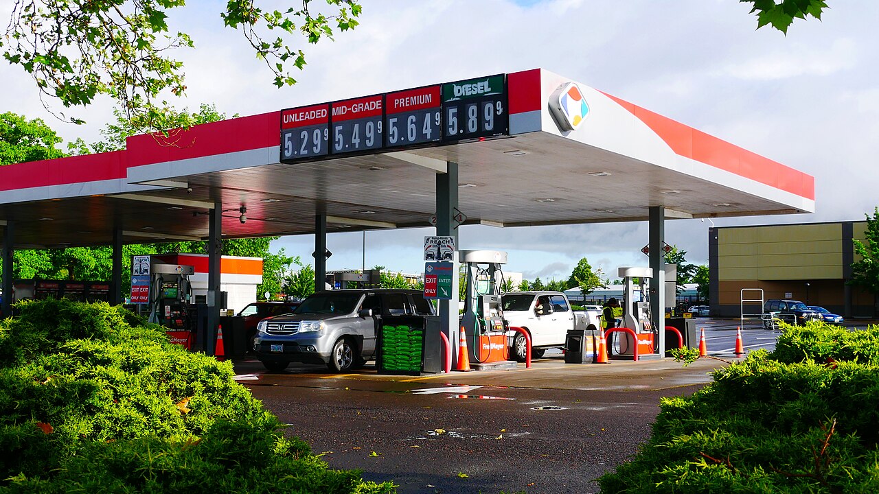 Gasoline prices posted on a station sign