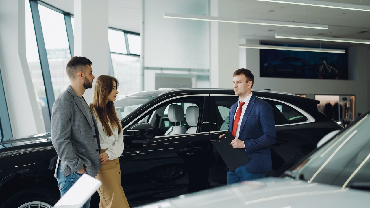 Five dealership workers will share $925,000 under a court-approved harassment and retaliation settlement