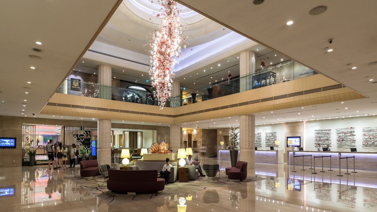 Twenty-four Anaheim hotel workers will split $2.75 million after California said the hotel ignored a law requiring their rehire